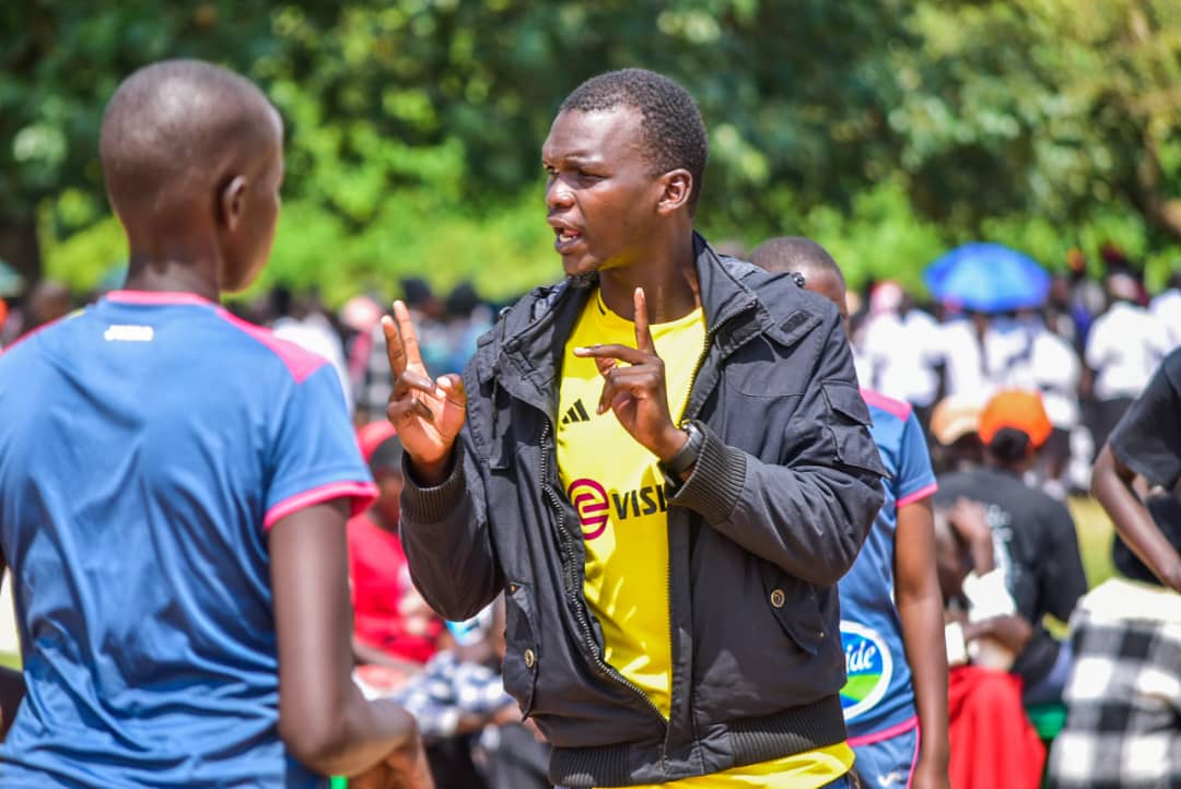 coach trust talks to one of the players during the game